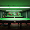 snooker table in dimly lit room